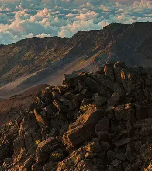 Rocky mountain landscape with dramatic clouds and sunset light in Hawaii